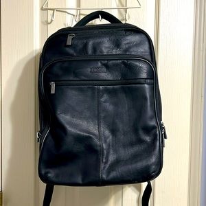 Reaction Kenneth Cole Messenger Backpack with many storage and organizer pockets